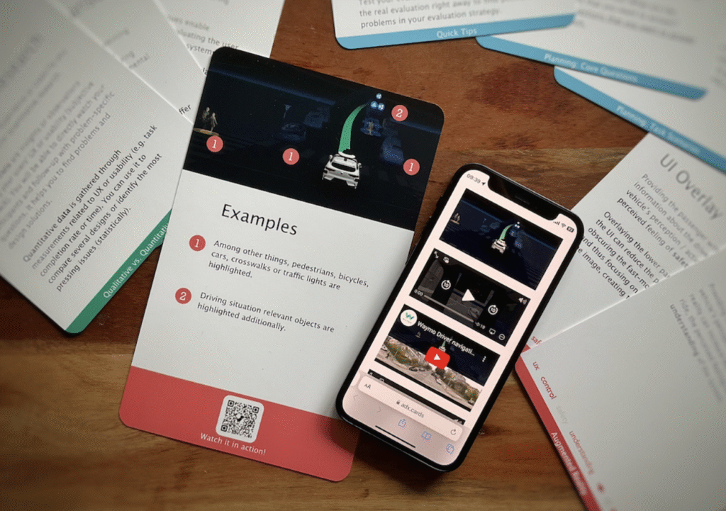 Picture of the transmedial toolkit adx cards consisting of the smartphone app and the physical workshop cards.