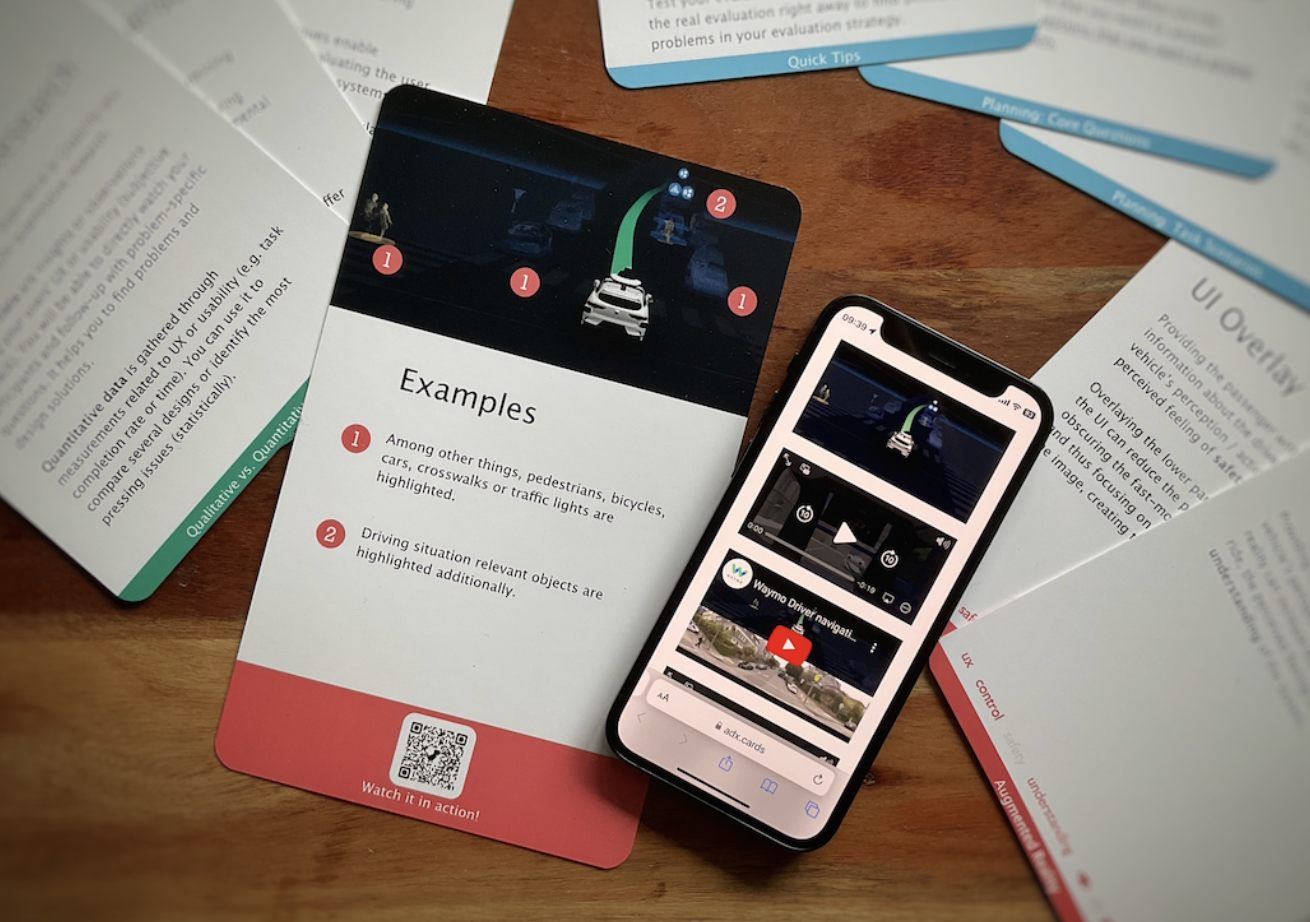 Picture of the transmedial toolkit adx cards consisting of the smartphone app and the physical workshop cards.