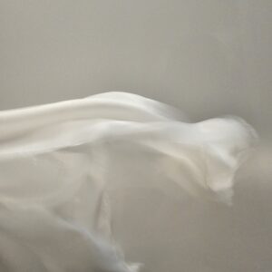 I photographed this moment to capture fabric caught in the breath of the wind.